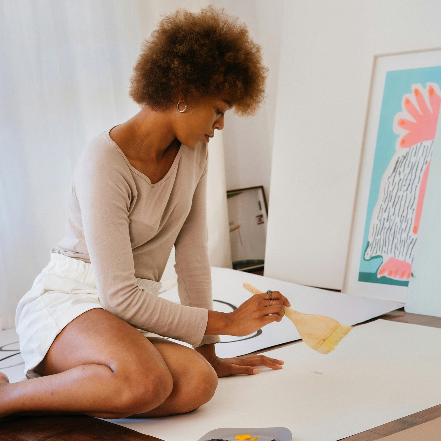 Creative woman making some artwork on paper